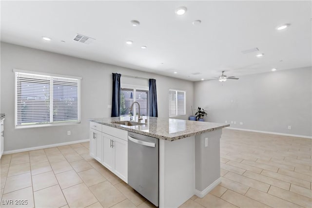 kitchen with a sink, visible vents, white cabinetry, dishwasher, and an island with sink