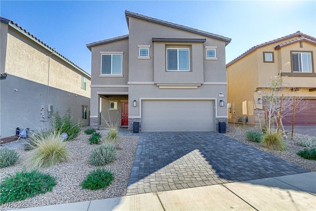 view of front of home featuring central AC unit, a garage, stone siding, decorative driveway, and stucco siding