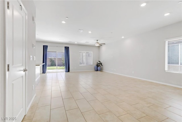 empty room with baseboards, a ceiling fan, and recessed lighting