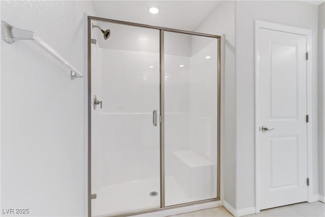 full bathroom featuring a shower stall