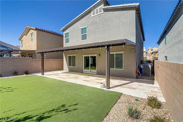 rear view of property with a patio, a fenced backyard, cooling unit, and stucco siding