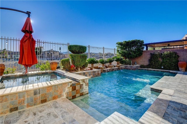 view of swimming pool with an in ground hot tub, a fenced backyard, and a fenced in pool