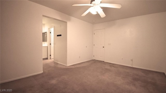 unfurnished room featuring ceiling fan, dark carpet, and baseboards