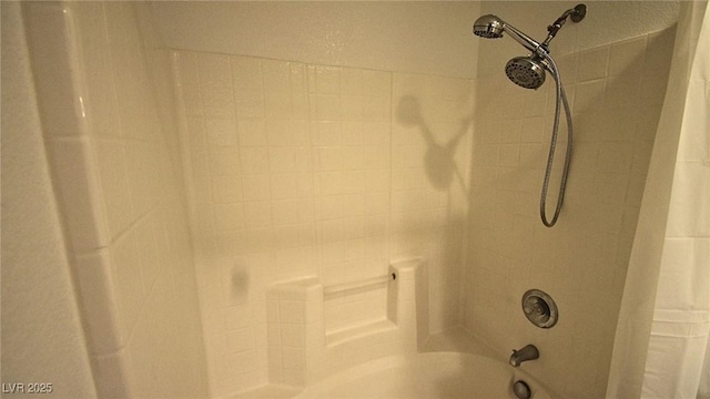 room details featuring tub / shower combination