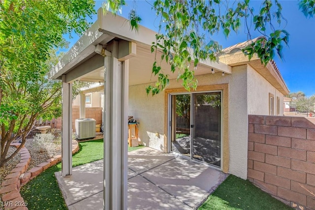 exterior space with cooling unit and fence