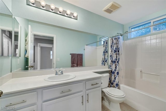 bathroom with visible vents, toilet, shower / bathtub combination with curtain, and vanity