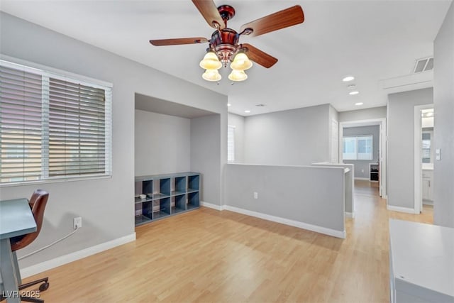 office area featuring light wood finished floors, baseboards, visible vents, and recessed lighting