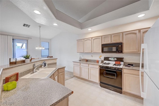 kitchen with black microwave, a sink, visible vents, light brown cabinetry, and gas range oven