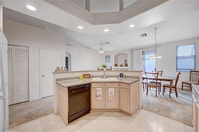 kitchen featuring light colored carpet, a sink, visible vents, dishwasher, and light brown cabinetry