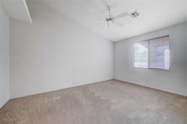 carpeted spare room with ceiling fan and visible vents