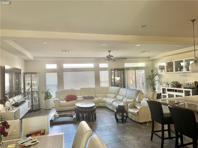 5320 Tartan Hill Ave, Las Vegas, NV 89141 - living room with dark tile patterned floors, visible vents, and a ceiling fan