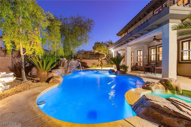 view of pool featuring a fenced in pool, a patio, an outdoor hot tub, a ceiling fan, and fence