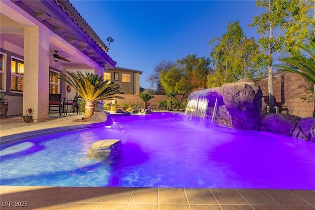 pool featuring ceiling fan and a patio