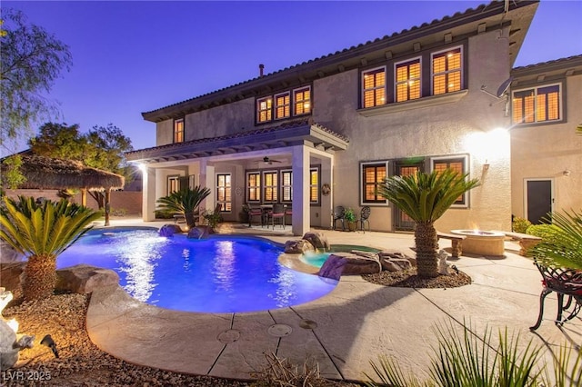 view of pool with a fire pit, a patio area, and a fenced in pool