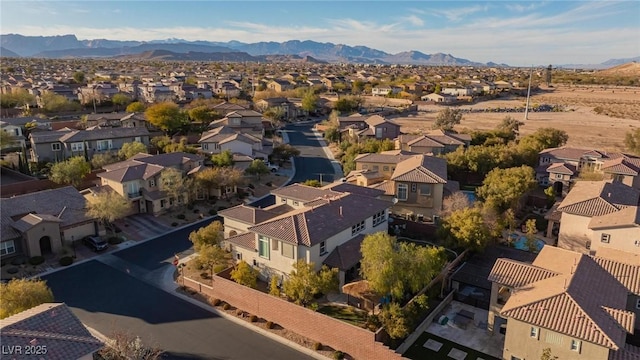 drone / aerial view with a residential view and a mountain view