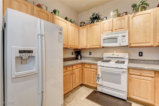 kitchen featuring white appliances, light countertops, and light brown cabinetry