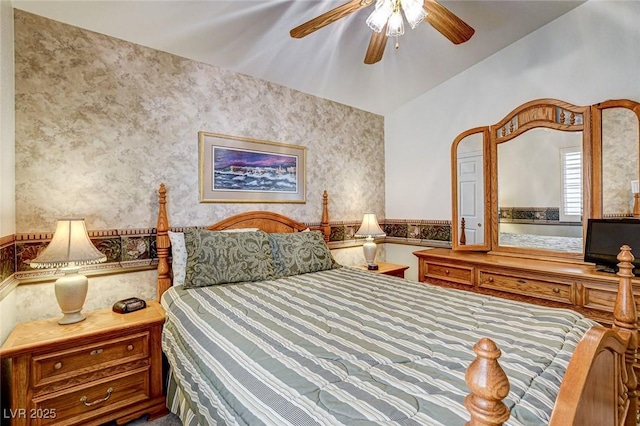 bedroom featuring wallpapered walls and a ceiling fan