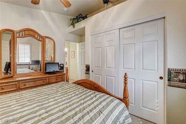 carpeted bedroom with a closet and ceiling fan