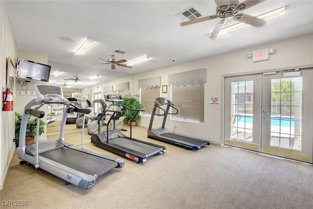 exercise room with visible vents, a ceiling fan, and french doors