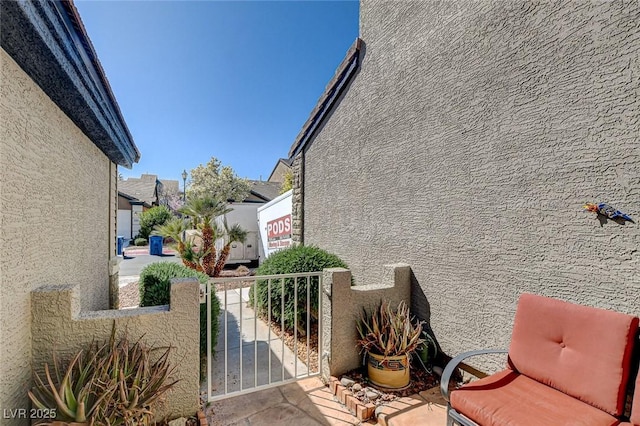 view of side of home featuring stucco siding