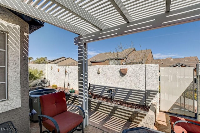 view of patio / terrace with a fenced backyard and a pergola