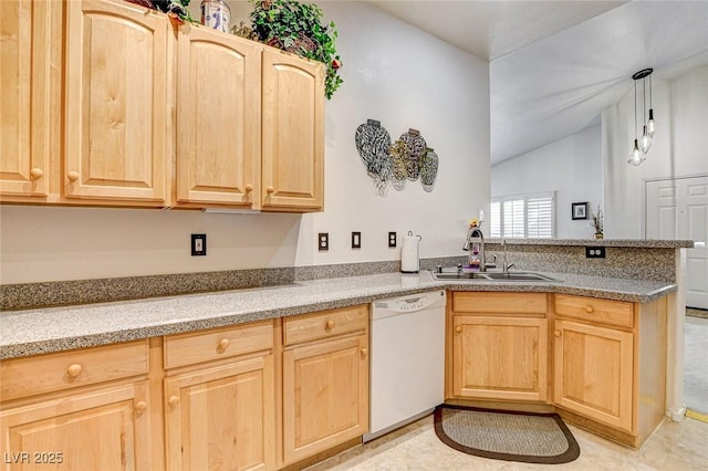 kitchen featuring dishwasher, a peninsula, hanging light fixtures, light brown cabinets, and a sink