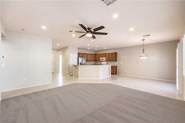 unfurnished living room featuring recessed lighting, ceiling fan, visible vents, and light colored carpet