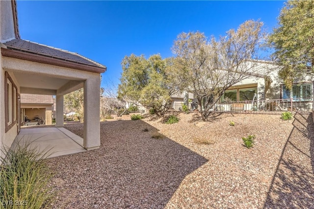 view of yard featuring a patio and fence