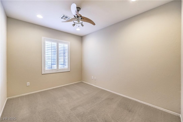 carpeted spare room featuring ceiling fan, visible vents, baseboards, and recessed lighting