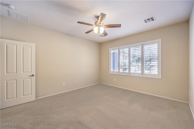 unfurnished room featuring light carpet, baseboards, visible vents, and a ceiling fan