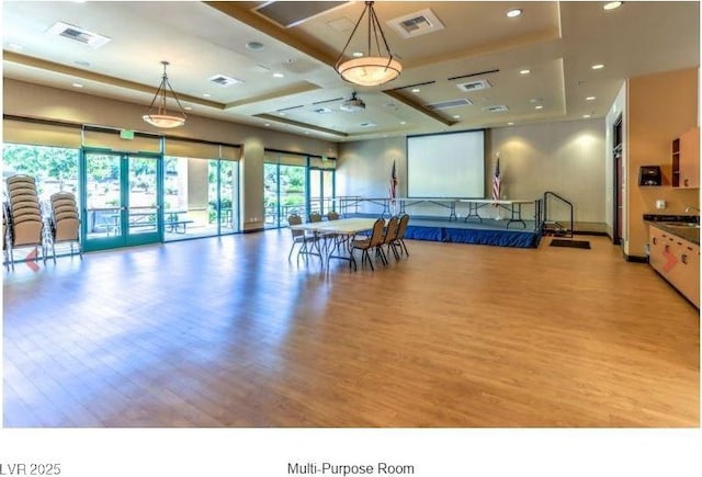 interior space featuring visible vents and light wood-style flooring