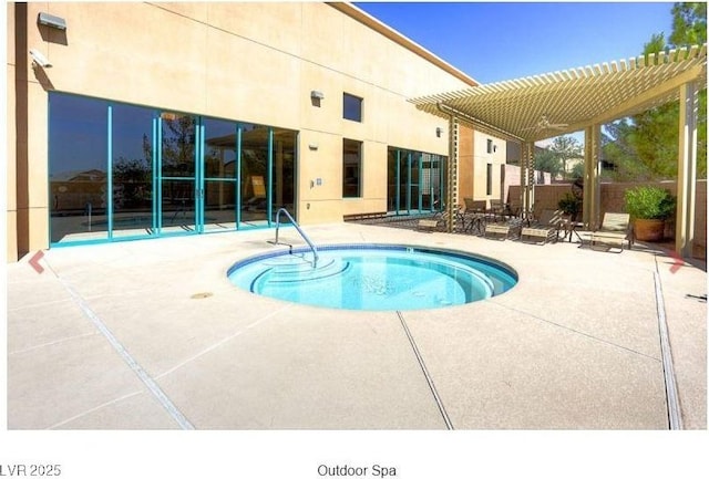 view of pool with a patio area, a pool, and a pergola