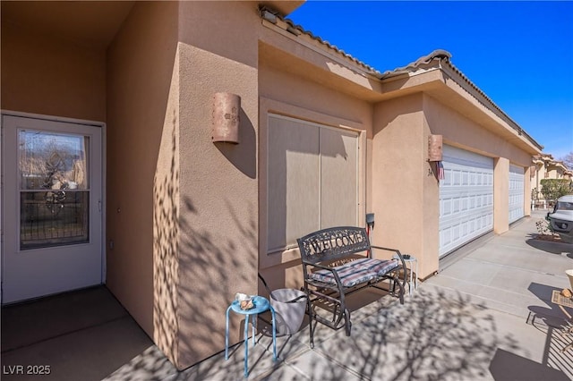 view of patio featuring a garage