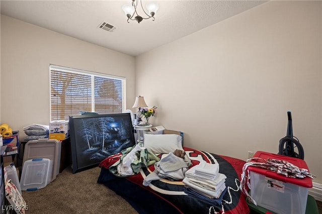 carpeted bedroom featuring visible vents