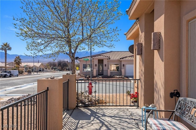 balcony featuring a mountain view and a residential view