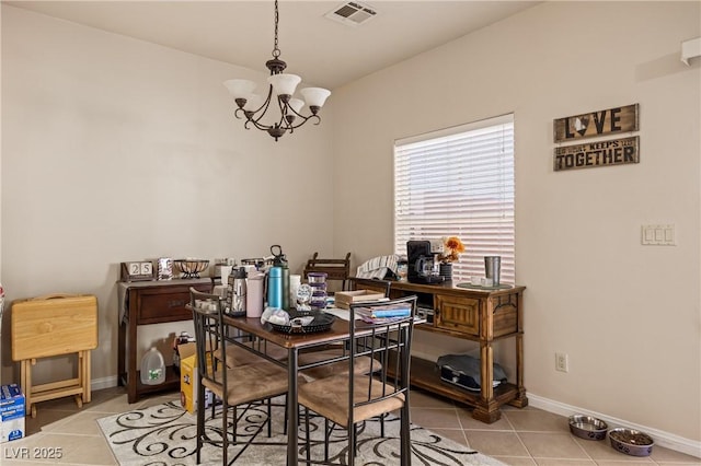 dining area featuring visible vents, a notable chandelier, baseboards, and light tile patterned floors