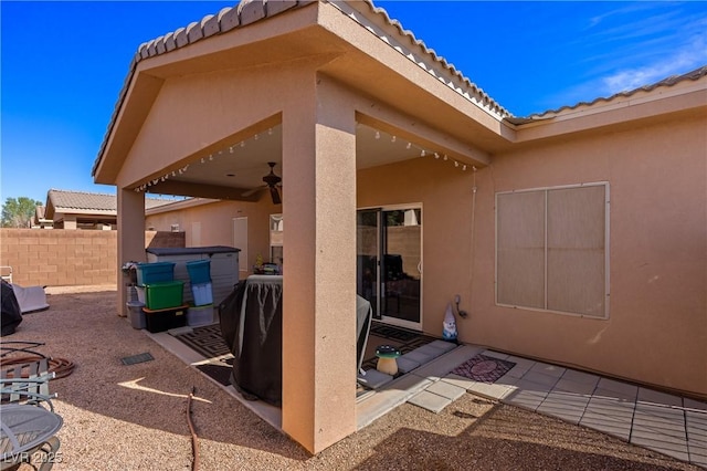 view of patio / terrace with fence and ceiling fan