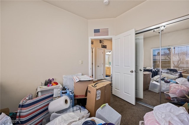 bedroom with visible vents, dark carpet, and a closet