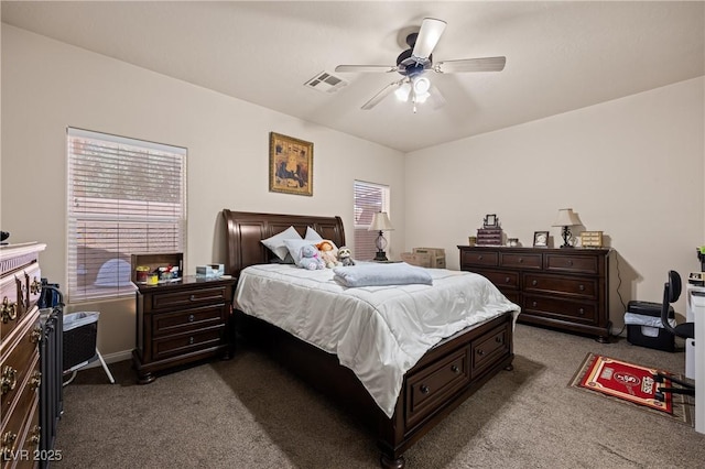 bedroom featuring a ceiling fan, visible vents, and carpet flooring