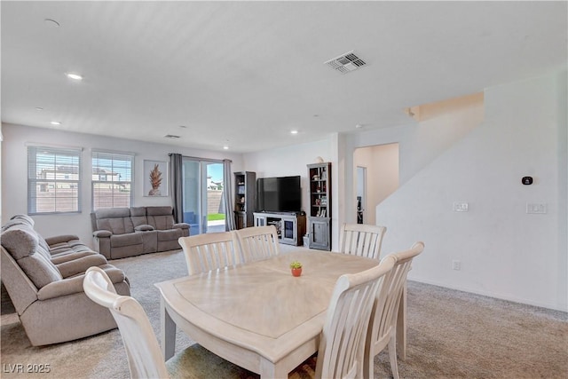 dining area featuring recessed lighting, visible vents, and light colored carpet