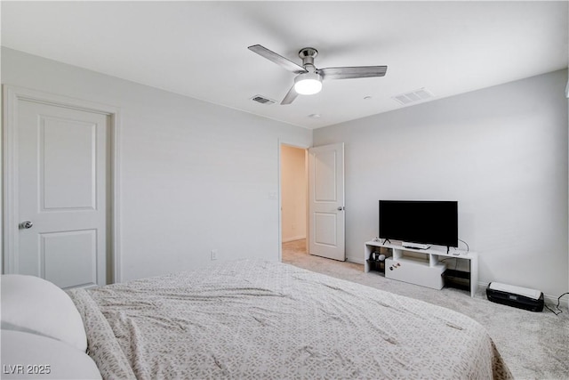 bedroom featuring baseboards, visible vents, a ceiling fan, and light colored carpet