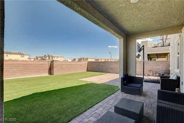 view of yard featuring a patio area and a fenced backyard