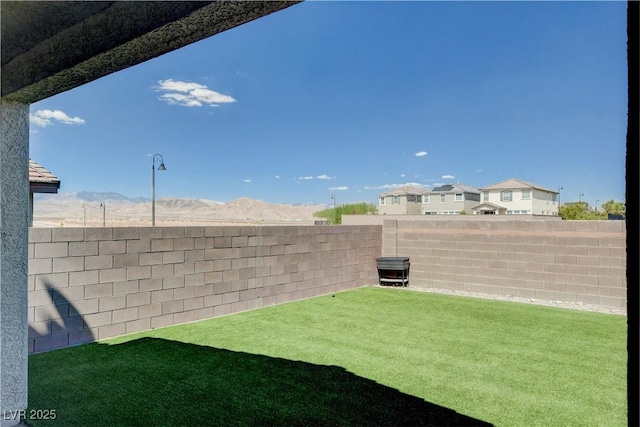 view of yard with a fenced backyard