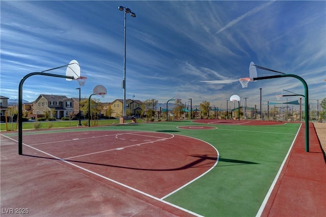 view of basketball court featuring community basketball court and a residential view