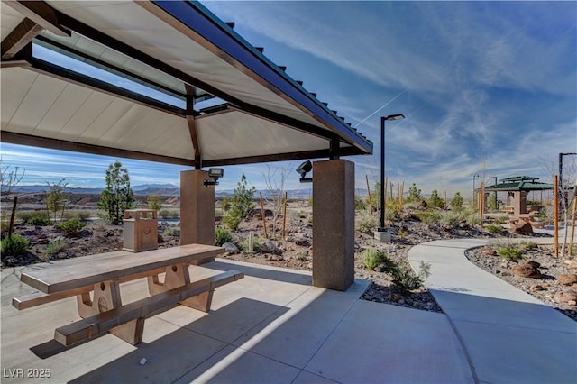 view of patio featuring a gazebo and a mountain view