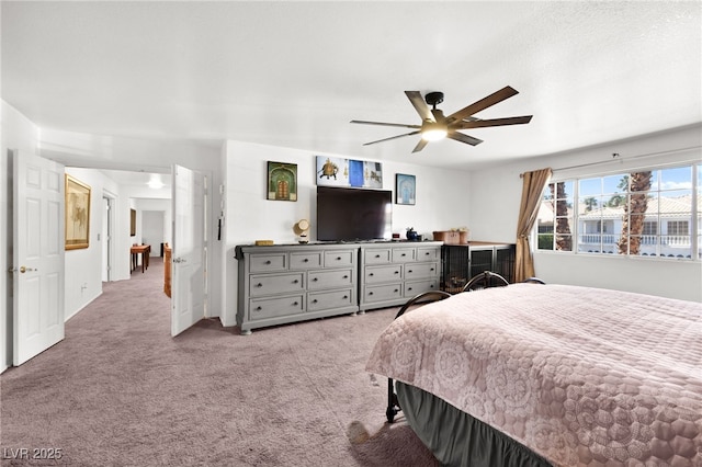 bedroom with light carpet and ceiling fan