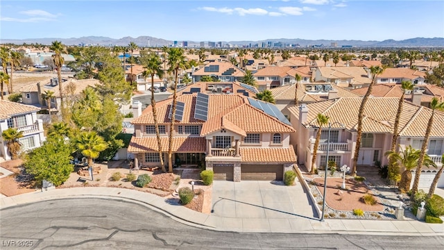 birds eye view of property with a mountain view and a residential view