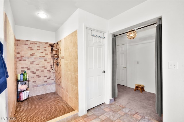 full bath featuring a stall shower and stone finish floor