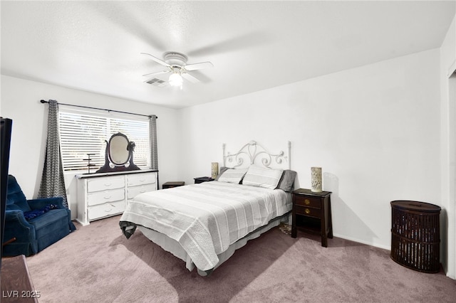 bedroom featuring a ceiling fan, light colored carpet, and visible vents