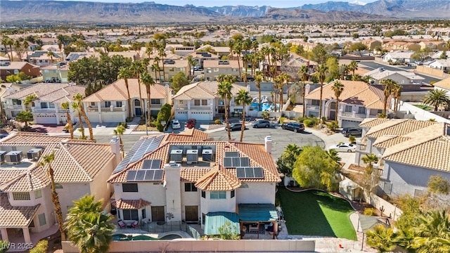 drone / aerial view featuring a residential view and a mountain view